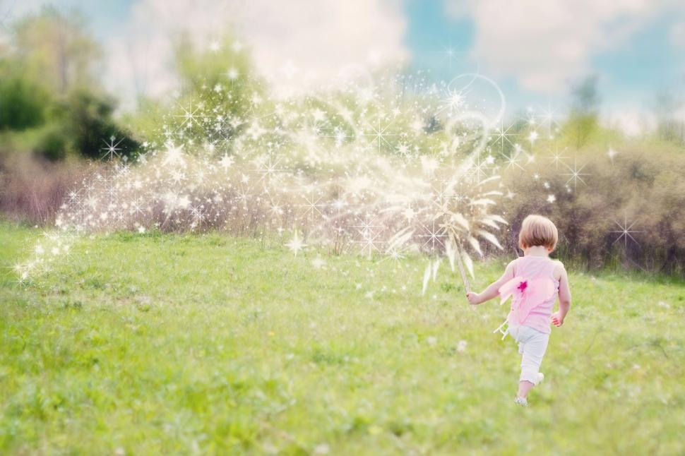 Free Image of Little girl and glitter trail 