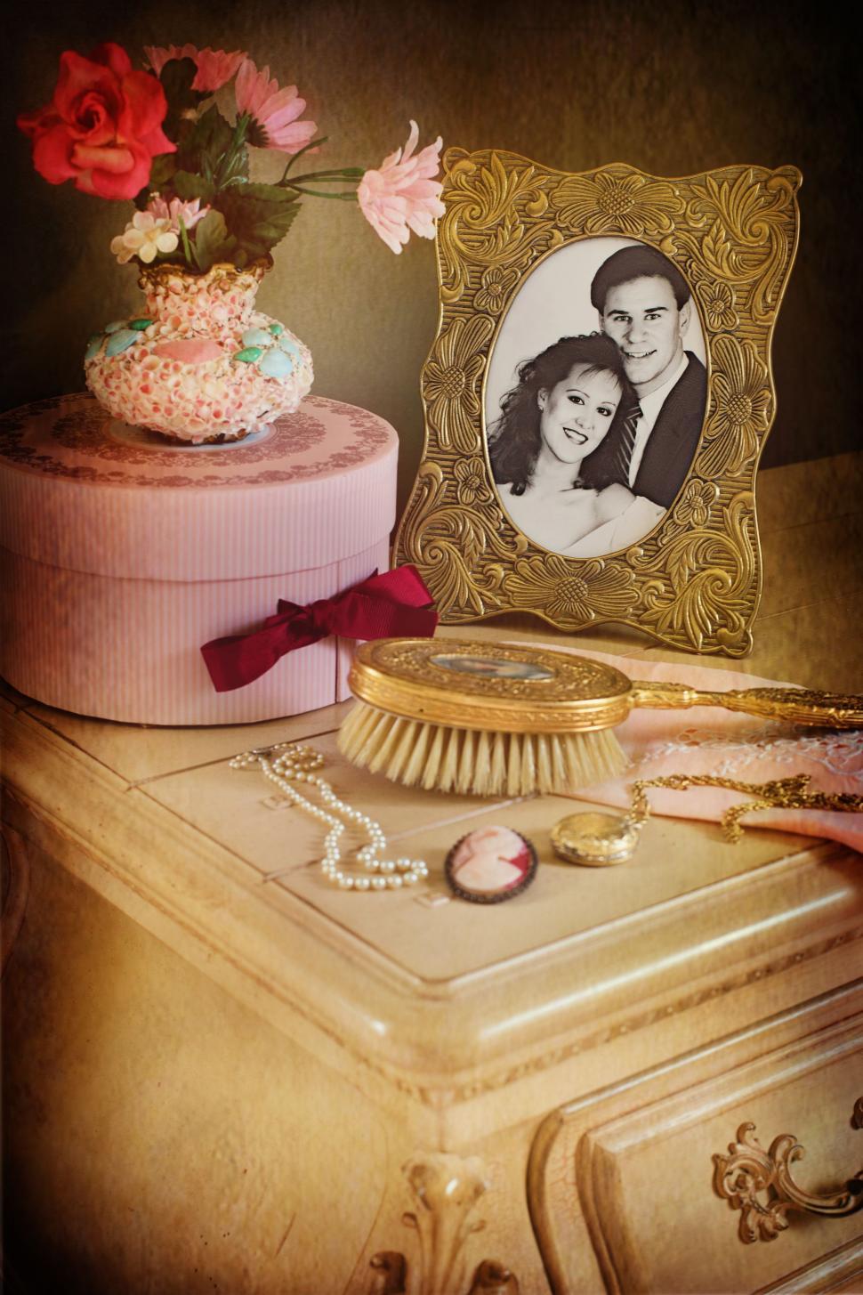 Free Image of Dresser with couple photo in frame 