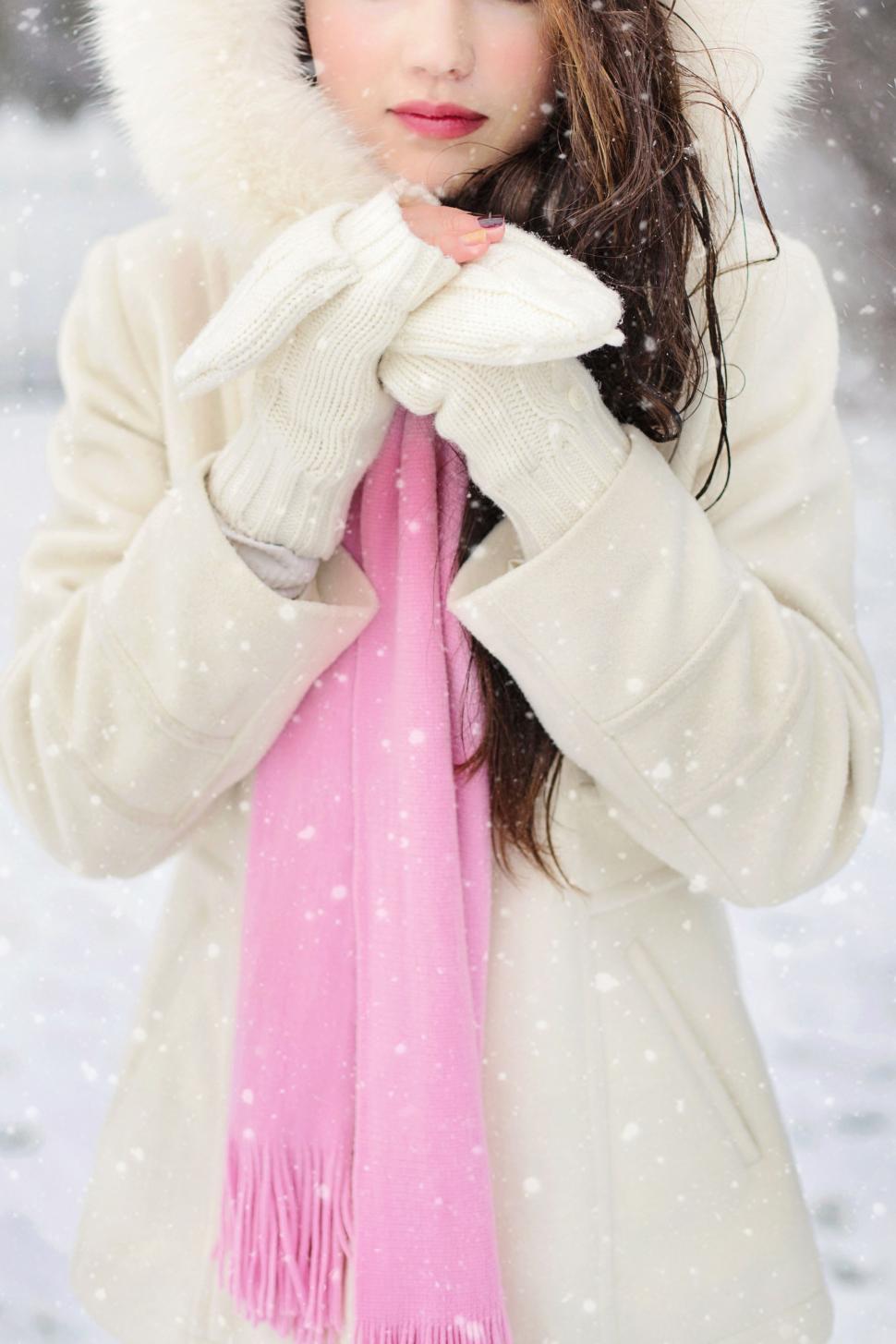 Free Stock Photo of Woman in white winter jacket in snow