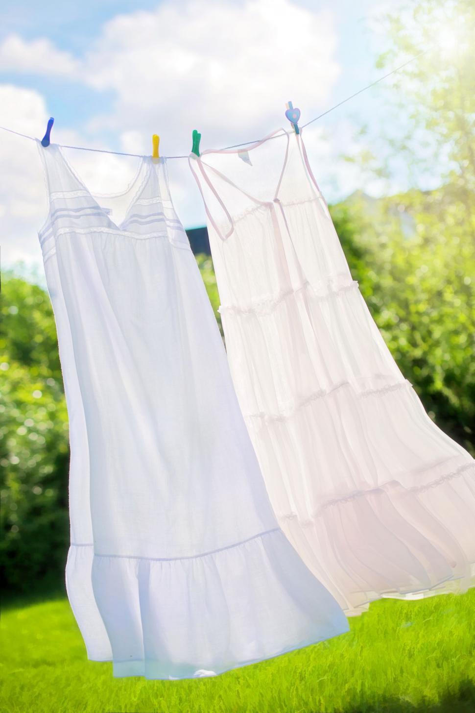 Linen Hanging On The Clothesline And Dried Stock Photo - Download