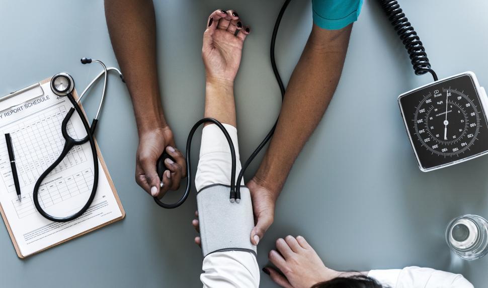 overhead-view-of-a-doctor-monitoring-blood-pressure.jpg
