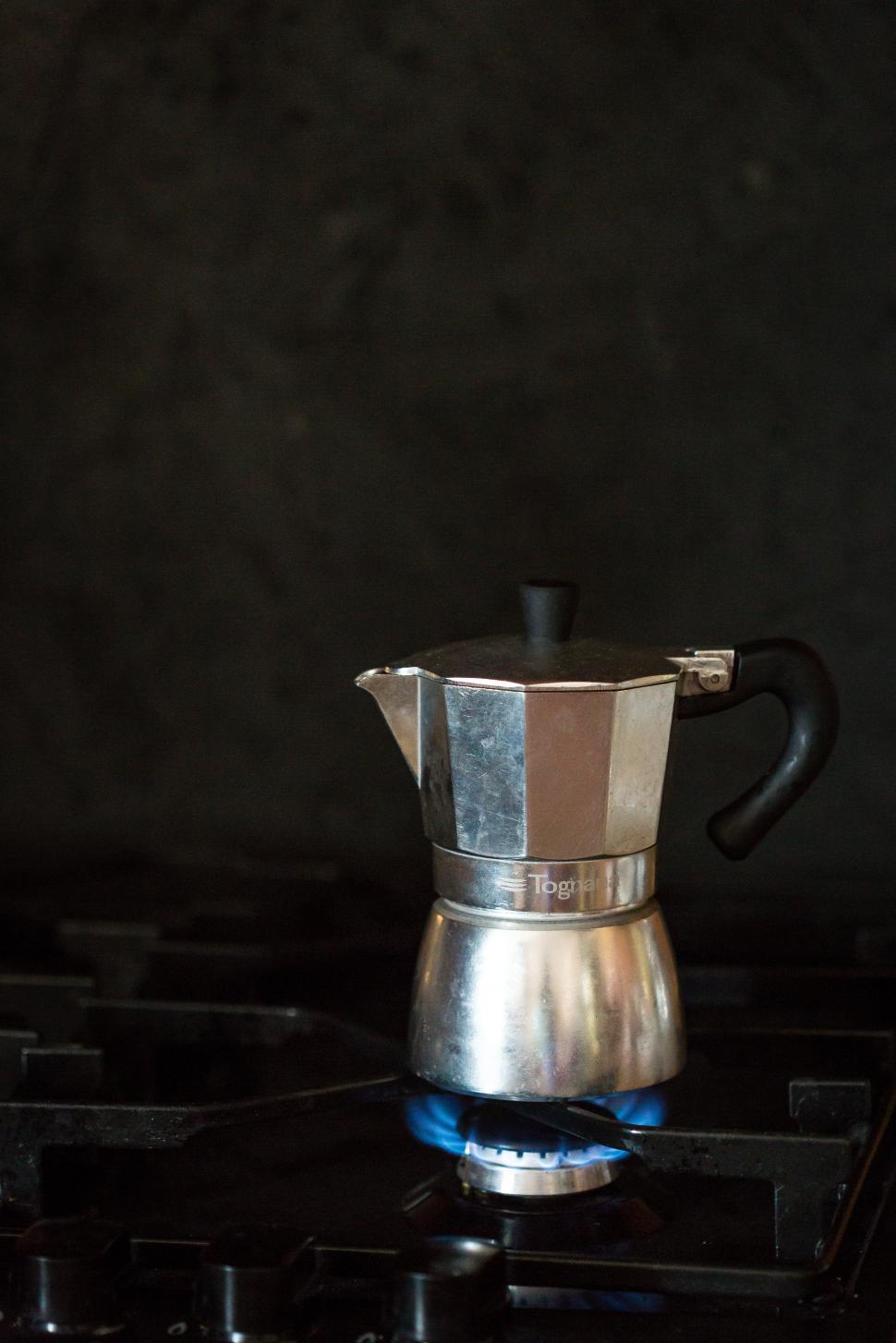 Italian Coffee Maker On Rustic Kitchen With Unfocused Background