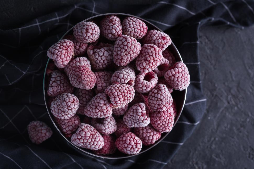 Free Image of Overhead view of frozen raspberries 