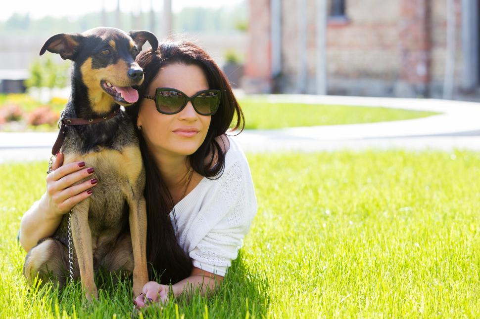 Free Image of Beautiful woman hugging dog 