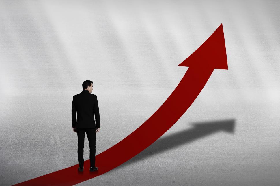 Free Image of Personal Growth Concept - Businessman on Red Upward Arrow 