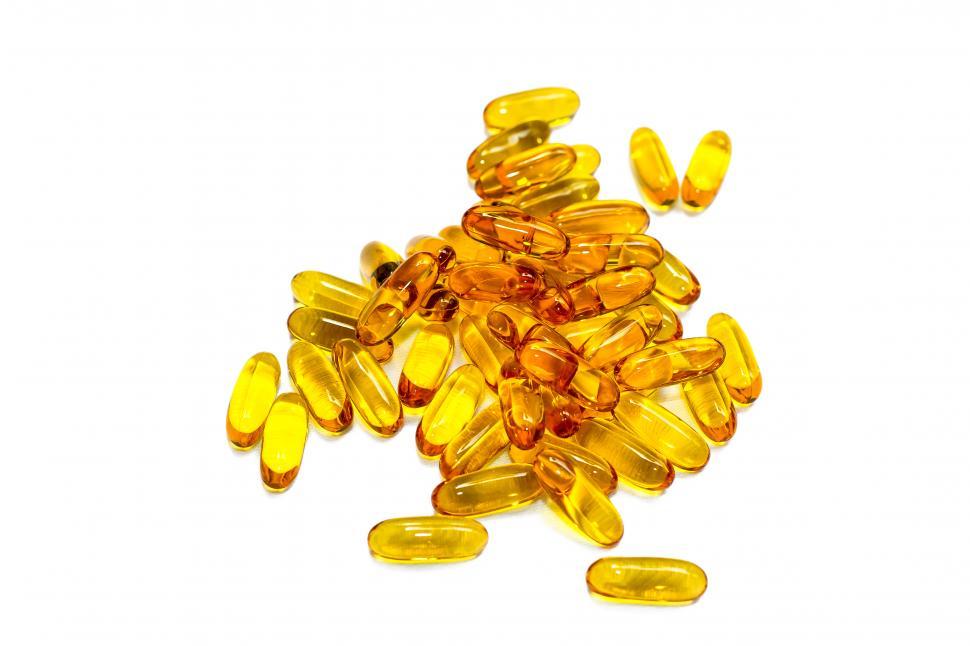 Free Stock Photo of Yellow scattered drug gelcaps Download Free