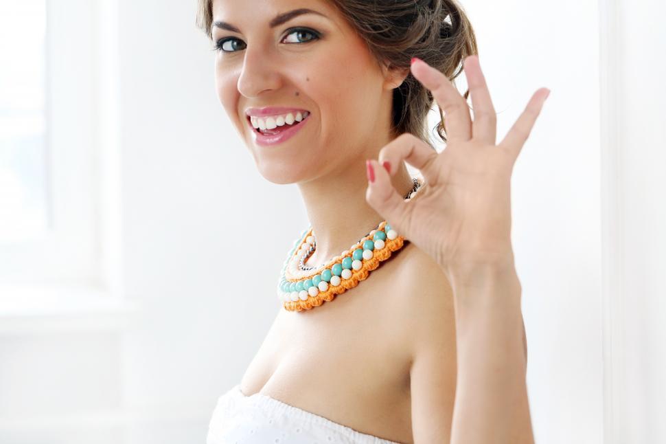 Free Image of Young woman wearing white dress  