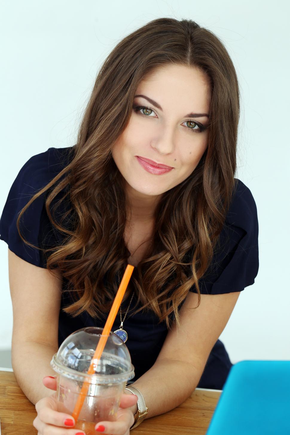 Free Stock Photo of Brunette woman looking at camera from work desk |  Download Free Images and Free Illustrations