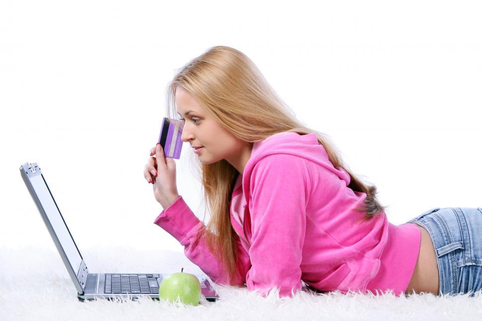 Free Image of happy smiling young girl shopping online 