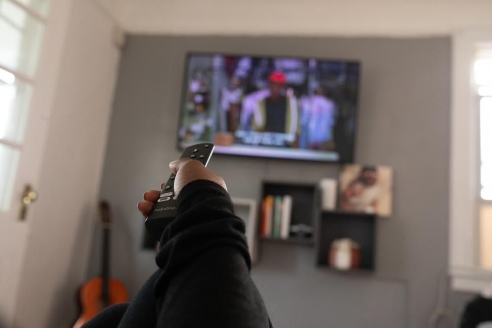 Free Image of TV Remote Control in Hand 