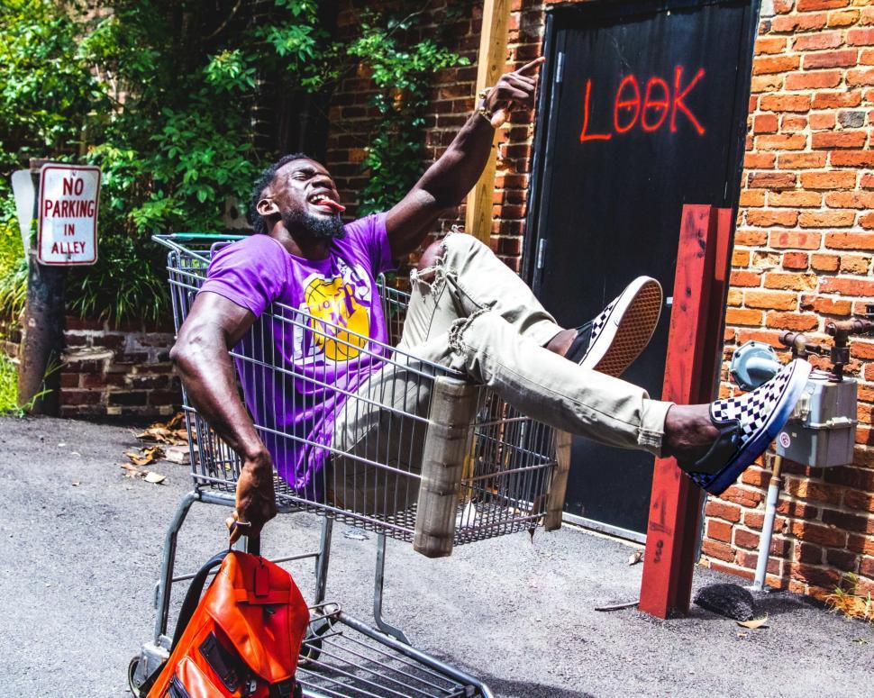 Free Stock Photo of Young Man and Shopping Cart, Having Fun Download