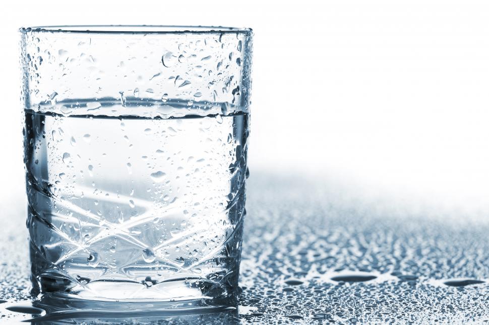 Free Image of Glass on the table with water drops 