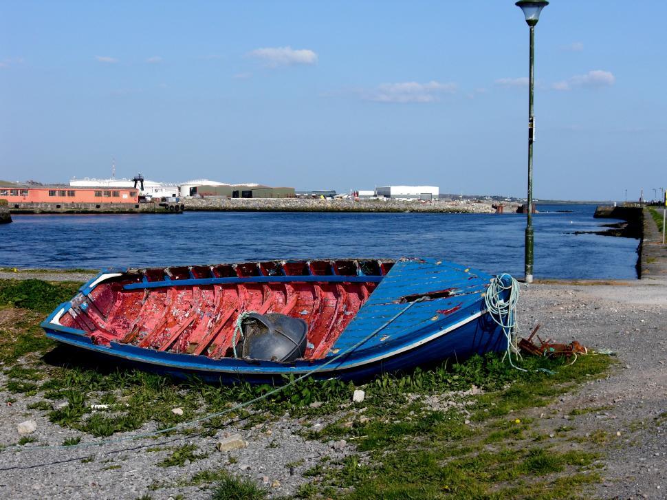 Free Image of Blue Boat on Grass-Covered Field 