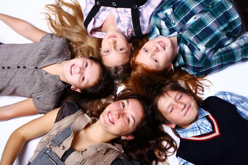 group of happy teen girls, over white background Stock Photo