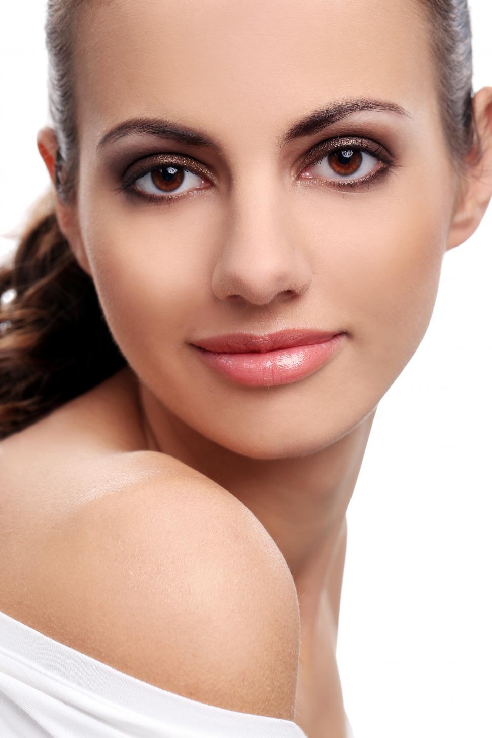 Free Image of Beautiful woman on a white background looking at camera 