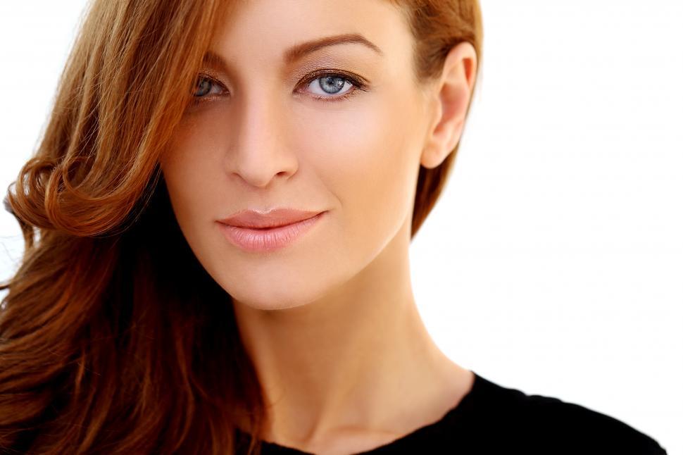 Free Image of Young woman with long hair on a white background 