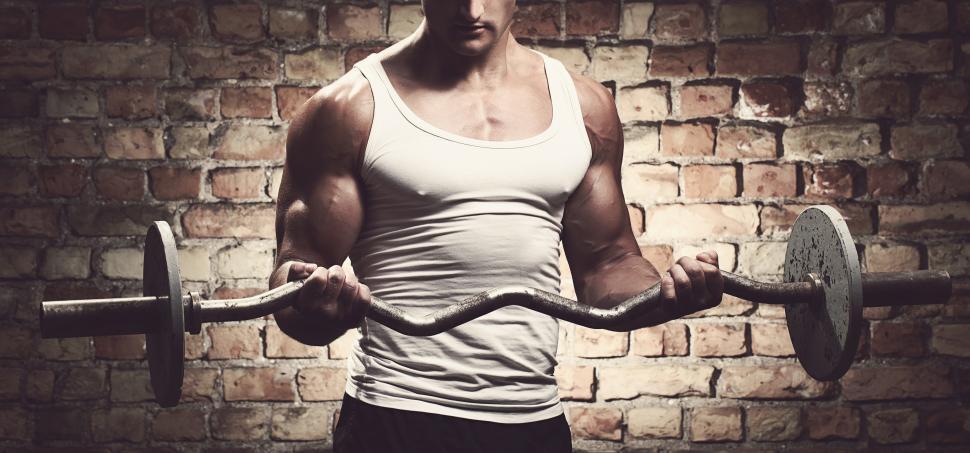 Free Image of Fitness. Man in tank top with barbell 