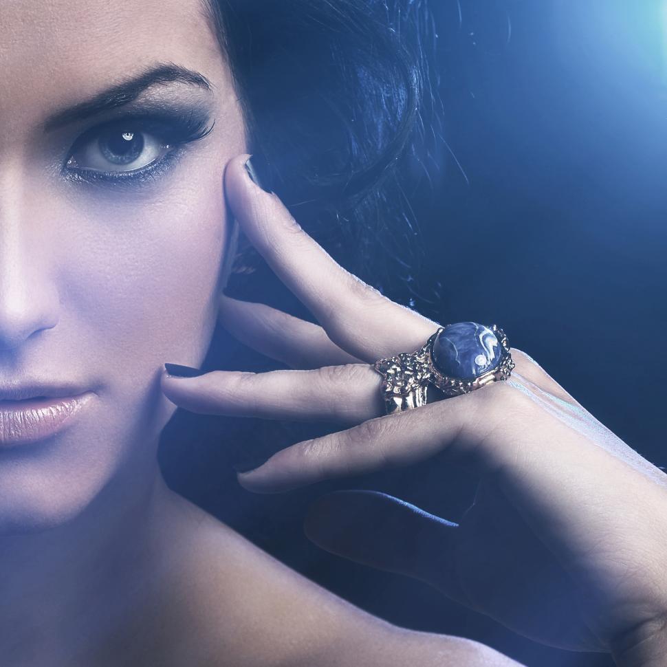 Free Image of Woman with ornate rings, half in frame 