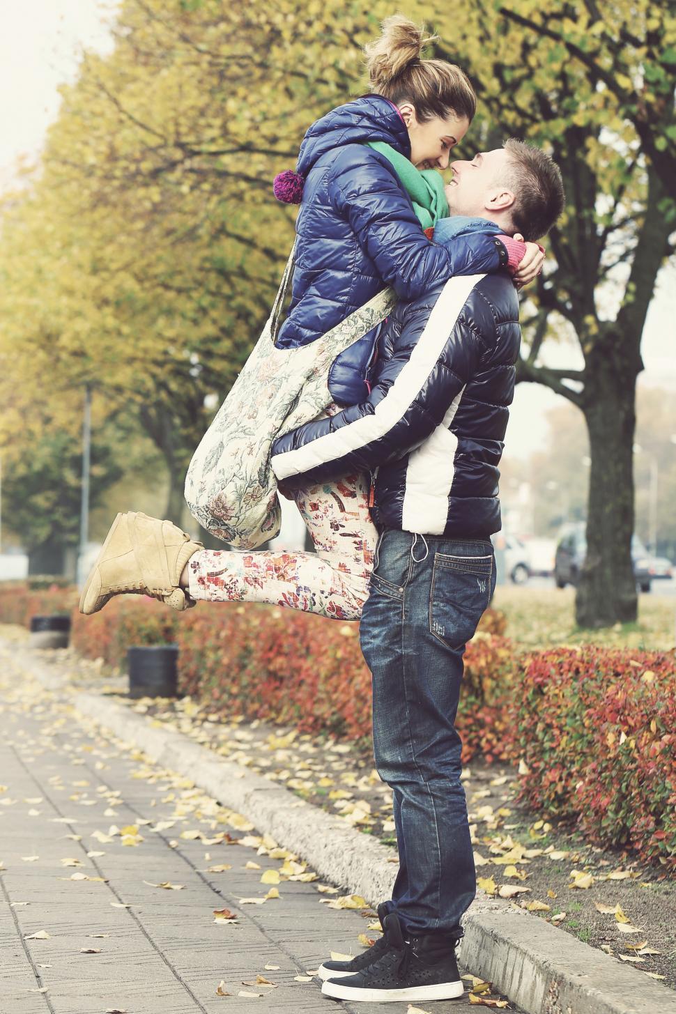 Free Image of Playful couple enjoying time together outdoors 