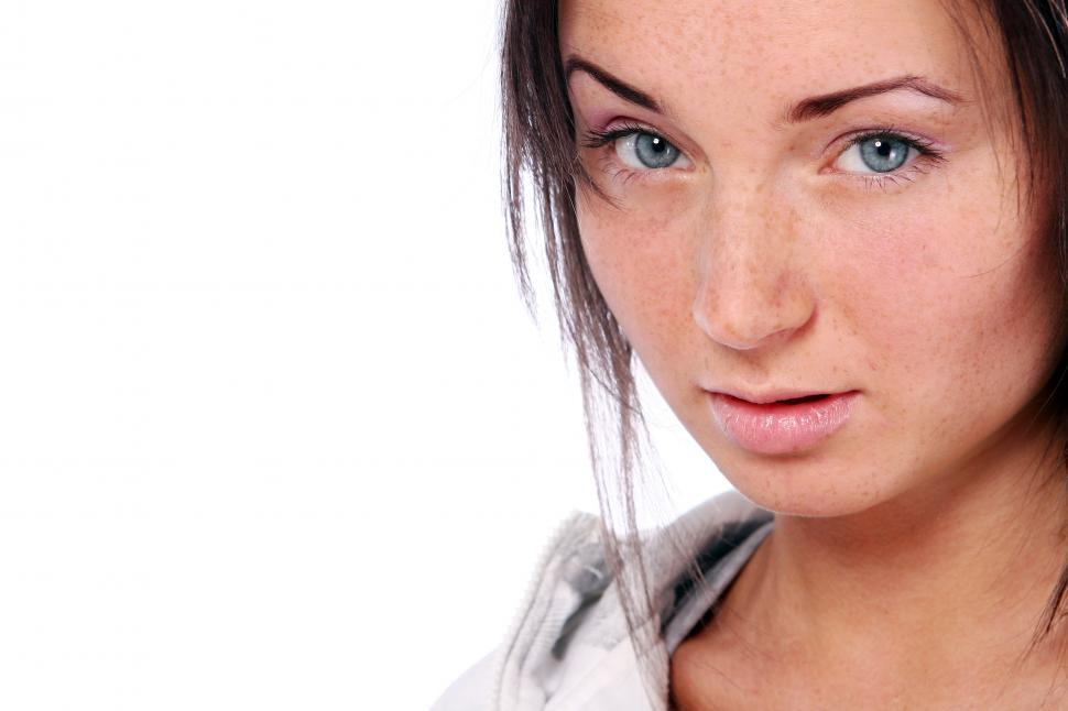 Free Image of Woman looking at the camera, half frame, with copyspace 