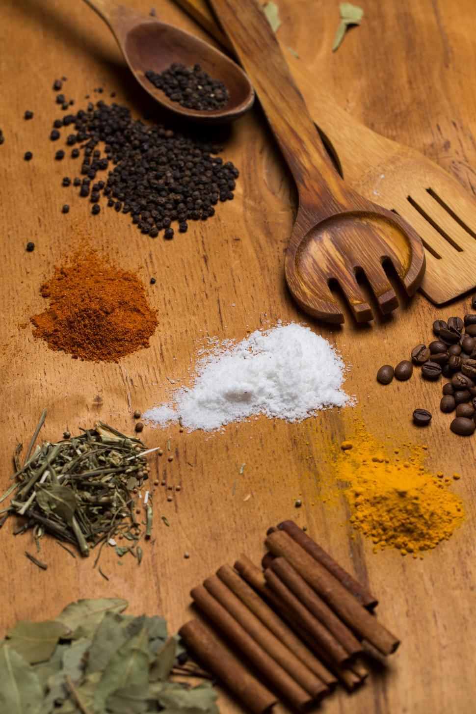 Free Image of Spices on the wooden table with wooden spoons 