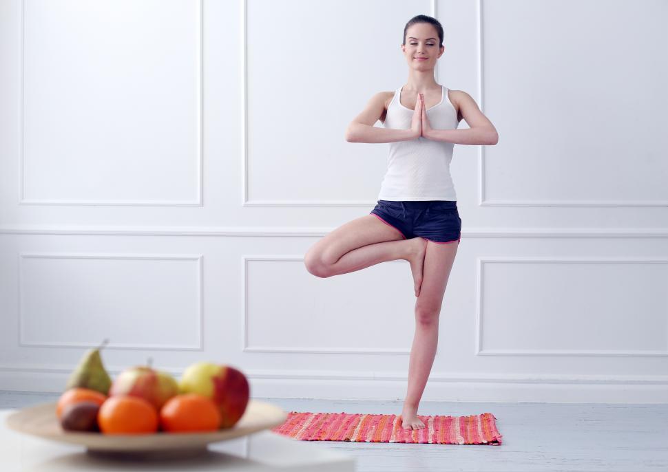 Free Image of Lifestyle. Woman in tree pose during yoga exercise 