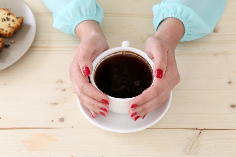 Free Image of Warming hands on coffee mug 