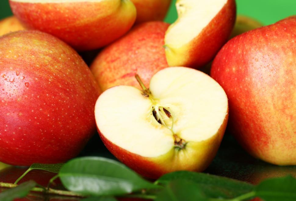 Free Image of Pile of fresh and tasty sliced and whole apples 