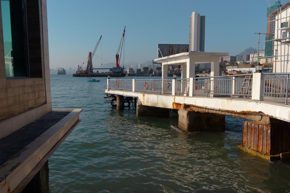 Free Image of Large Body of Water Next to a Pier 
