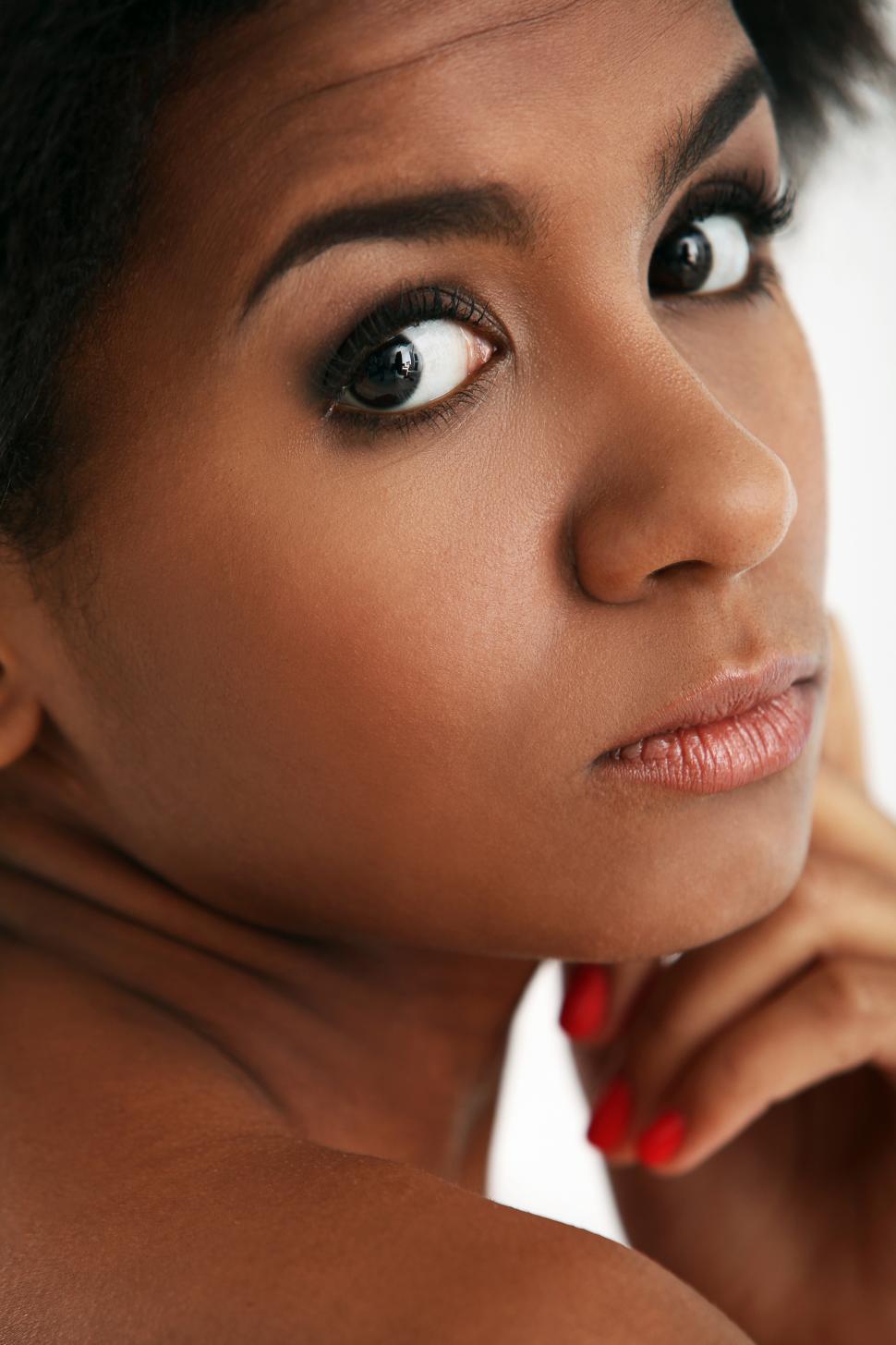 Lovely black woman looking over her shoulder with a thoughtful and serious  expression Stock Photo - Alamy