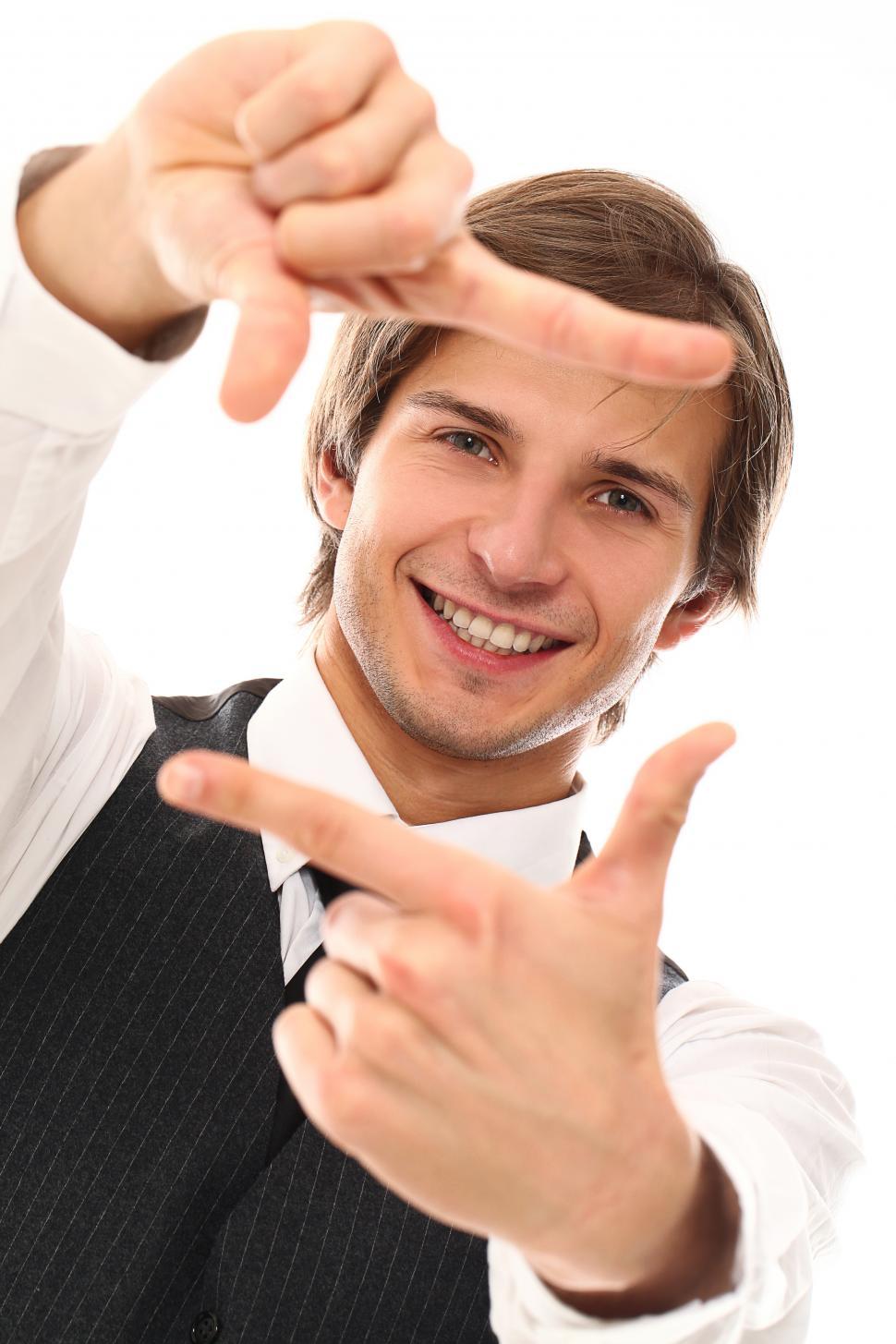 Free Image of Man framig scene with fingers 