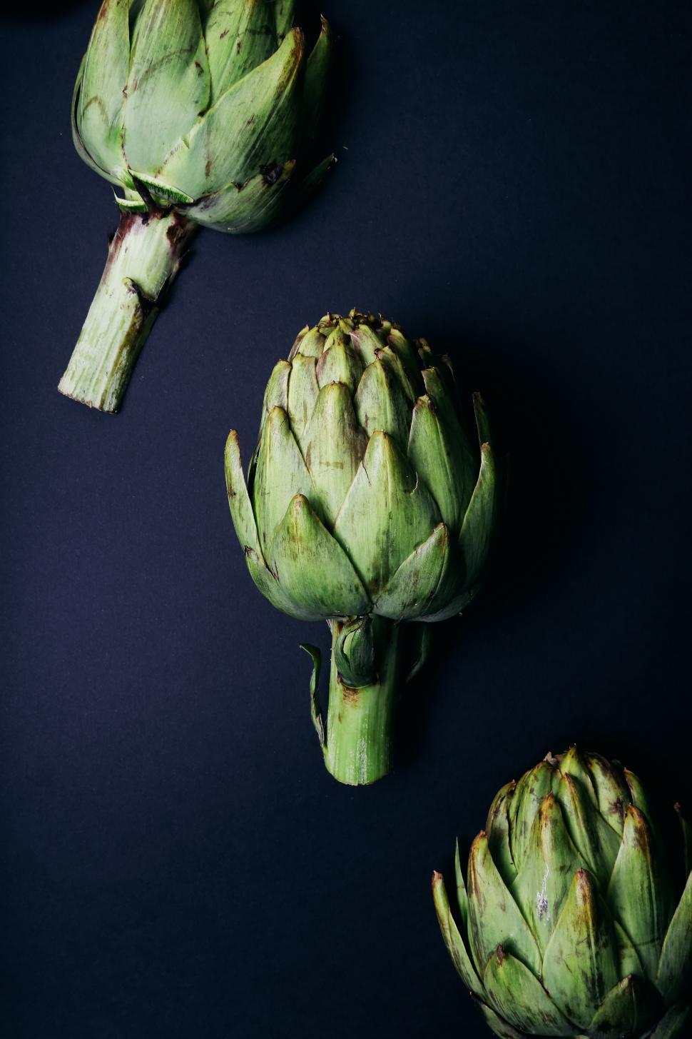 Free Stock Photo of Artichokes arranged on a dark background | Download ...