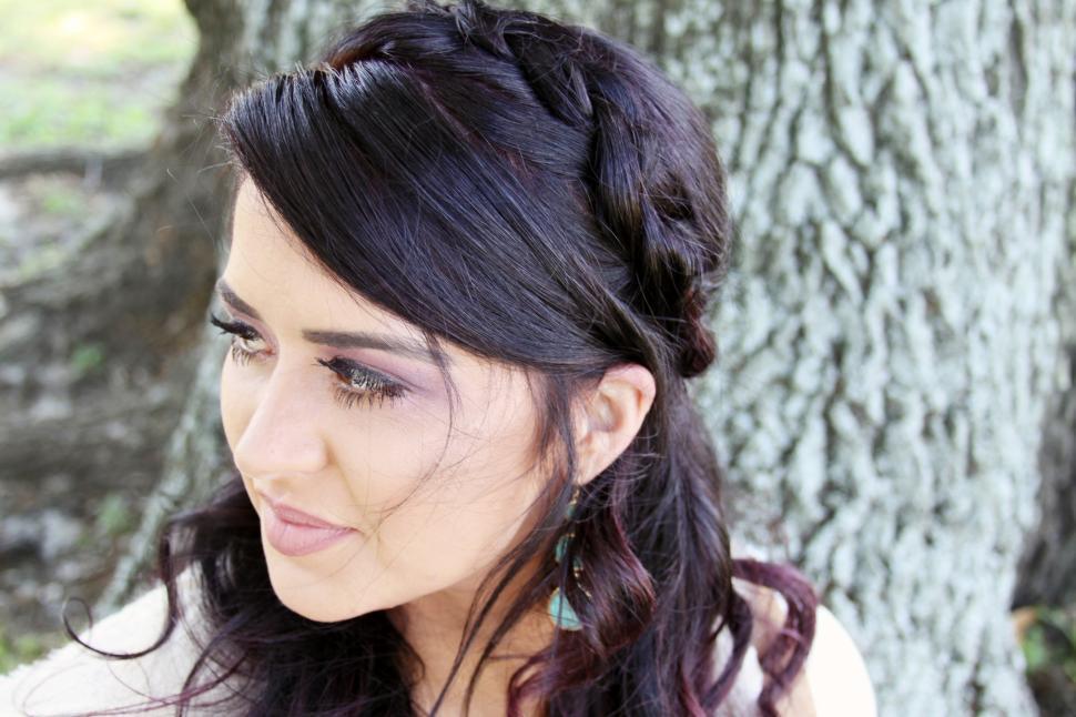 Free Image of Side view of woman face with tree in the background 
