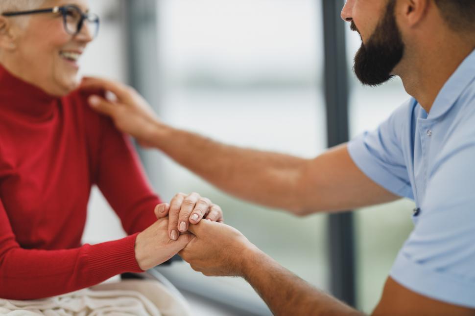 Free Stock Photo of Male caregiver talking to old-aged woman in ...