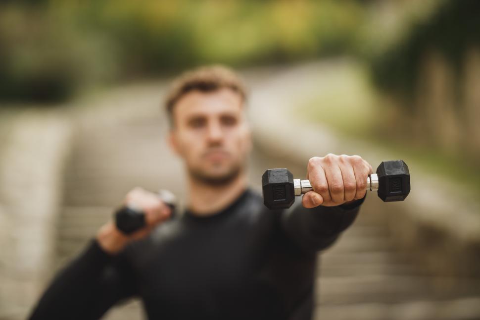 Free Image of Young man with dumbbells 