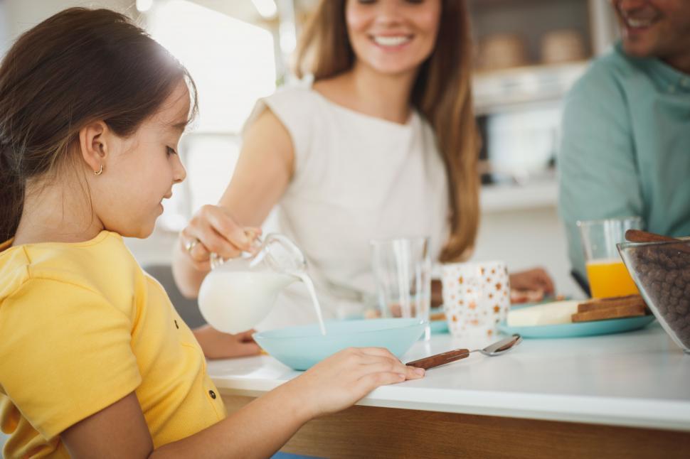 Free Image of Happy Caucasian family having breakfast at home 