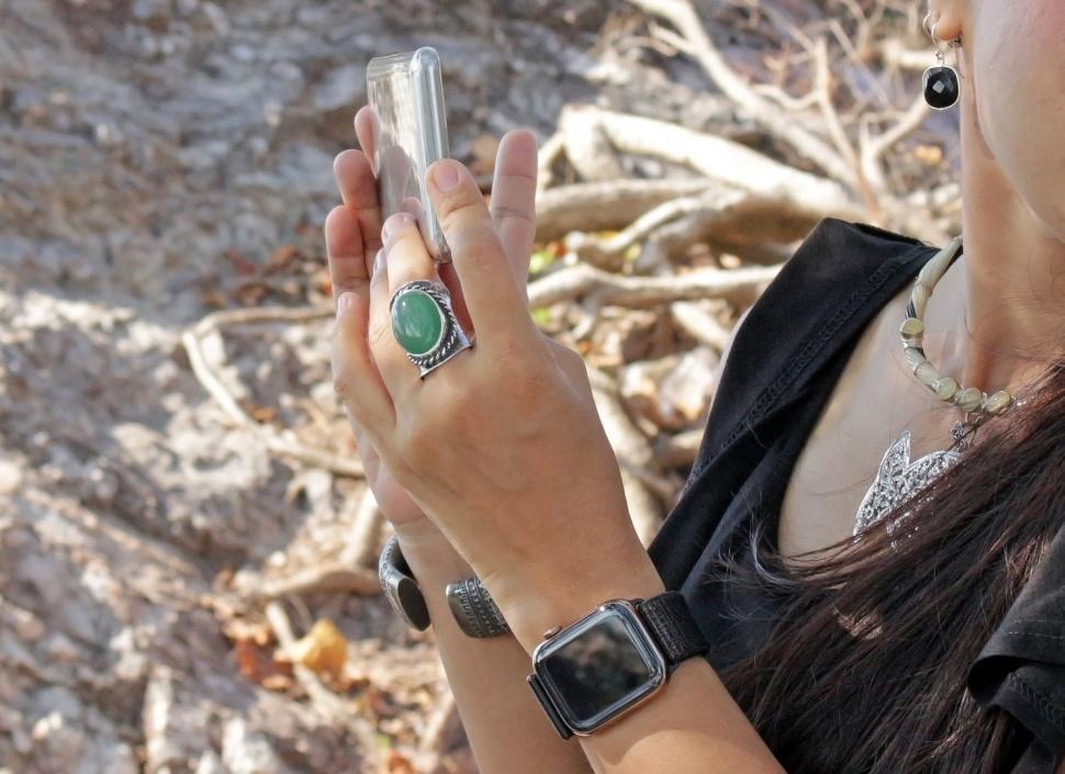Free Image of Woman's hand holding a modern Smart phone  
