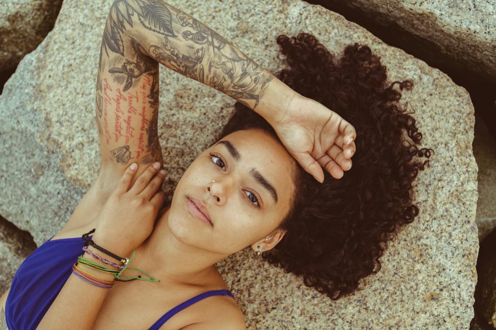 Free Image of Tattooed woman in blue bikini 