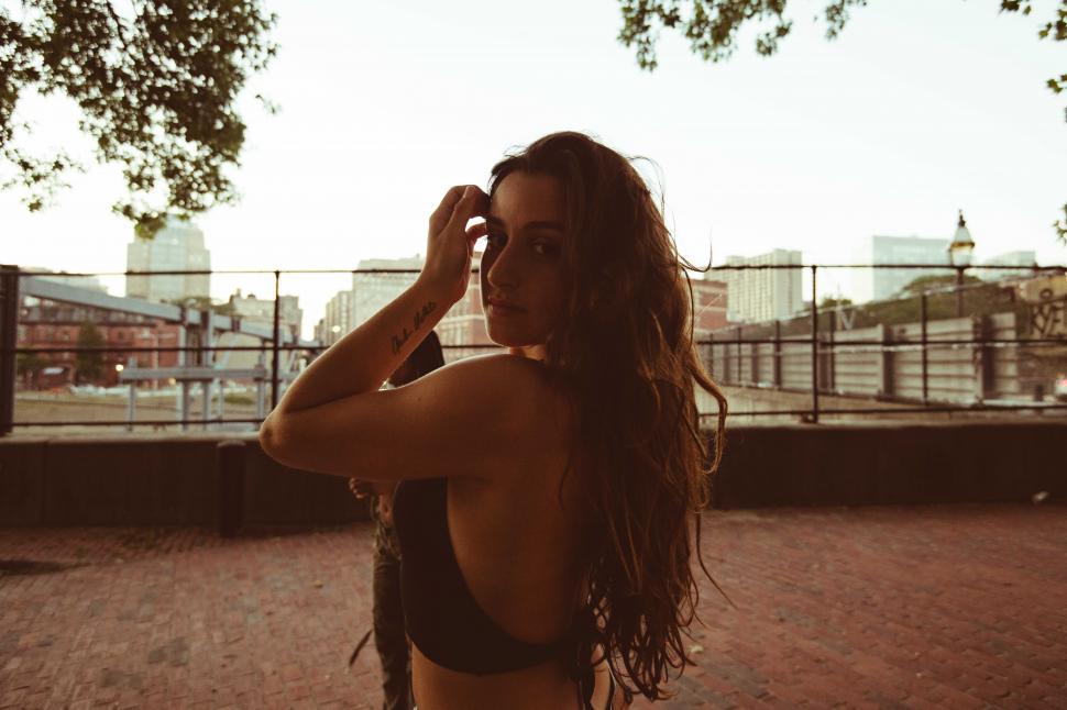 Muscular female back in black bikini. Stock Photo