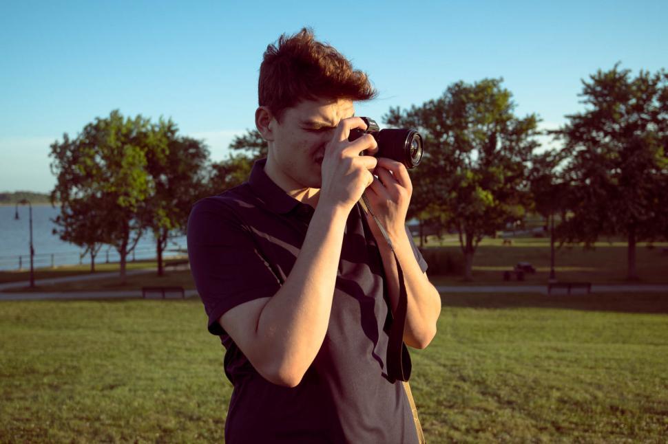 Free Image of Young man with camera in the park 