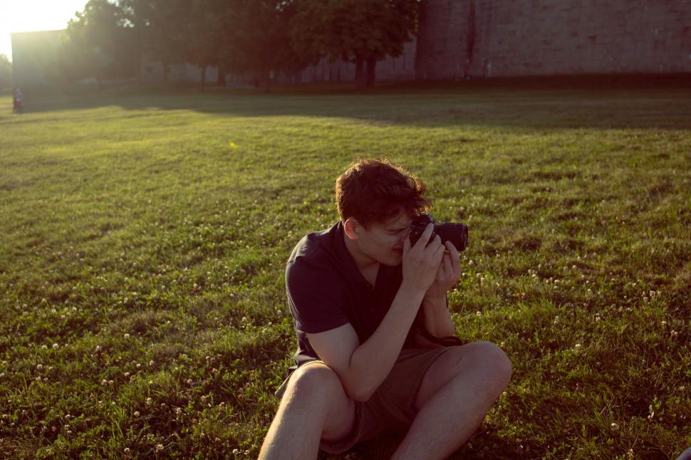 Free Image of Male photographer with camera in the park 
