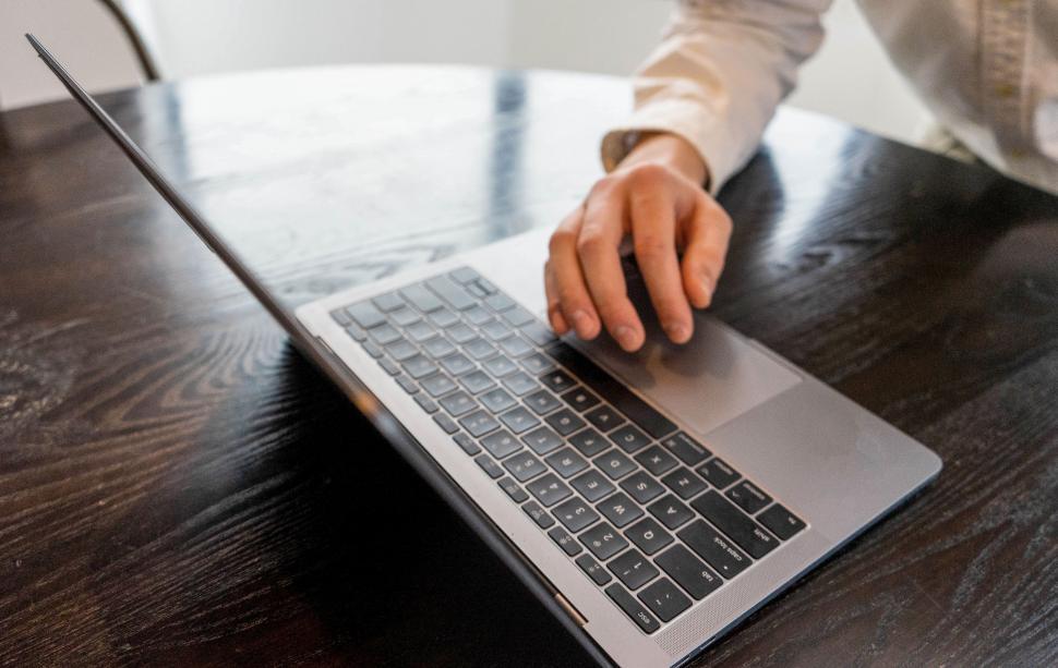 Free Image of Fingers on laptop keyboard 
