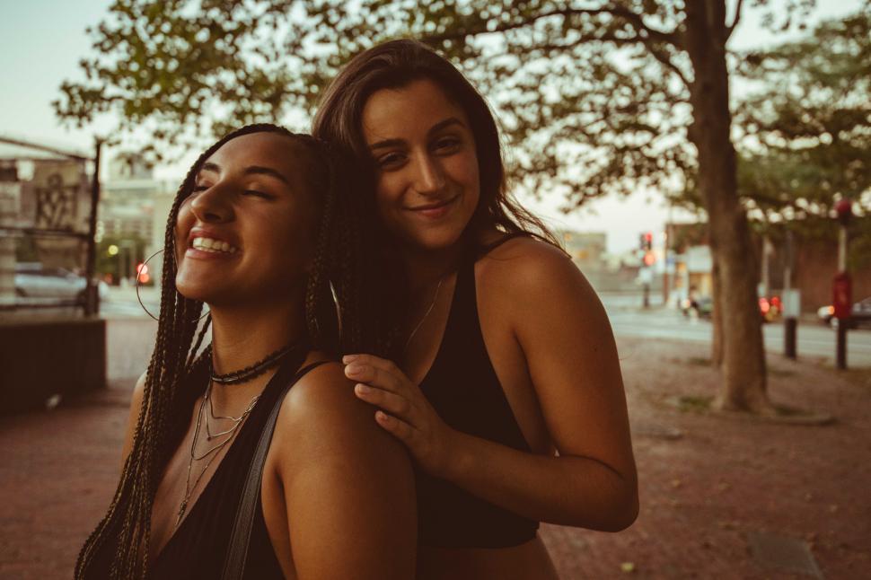 Free Image of Two fashionable women posing together in the park 