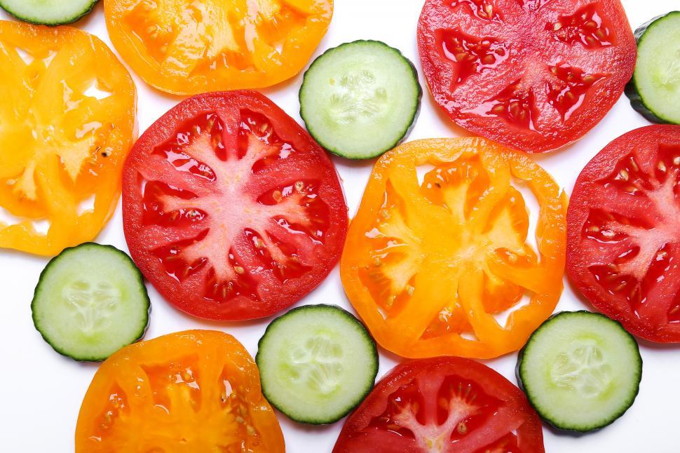 Free Image of Vegetables sliced and laid on white background 
