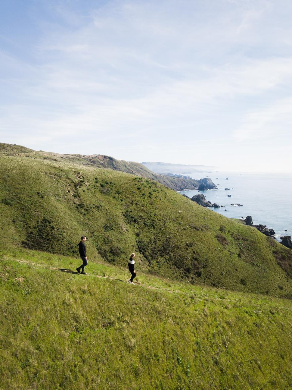 Free Image of Couple on green mountain 