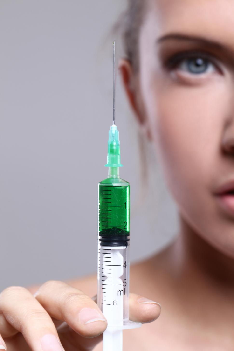 Free Image of Woman holding a syringe  