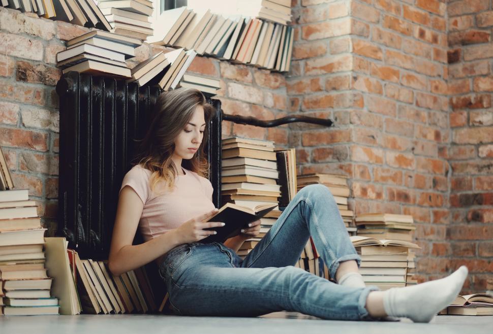 Free Image of Education - Girl surrounded by books 