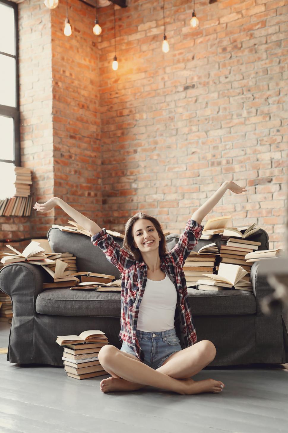 Free Image of Education - Happy young woman in studio 