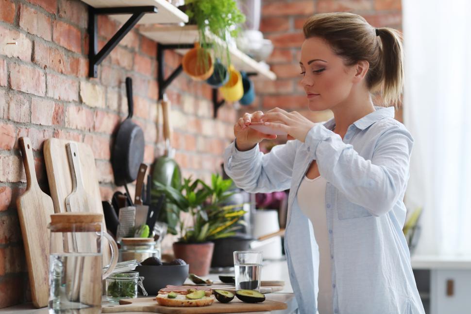 Free Image of Woman photographer her avocado toast 