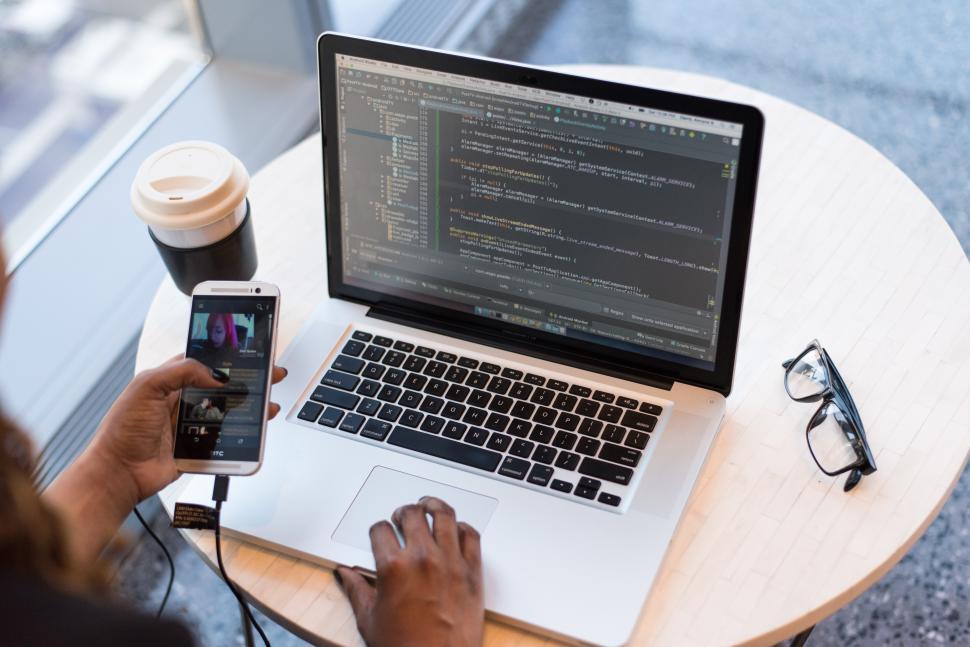 Free Image of Female software engineer with laptop and smartphone 